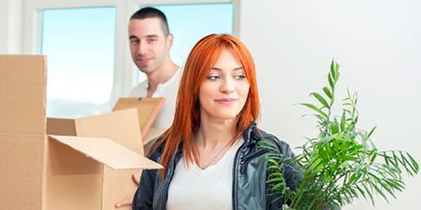 A couple packing some boxes together to be stored at Urban Storage on Bennett in Bellingham, Washington