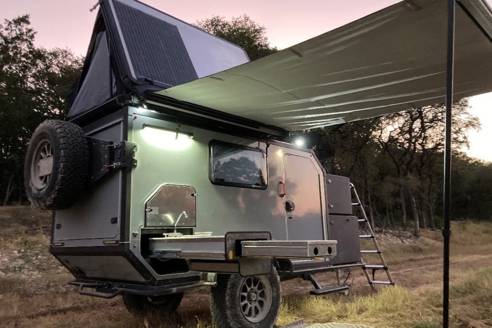 StorQuest Self Storage guest Adventure ATX Rentals camper with open canopy