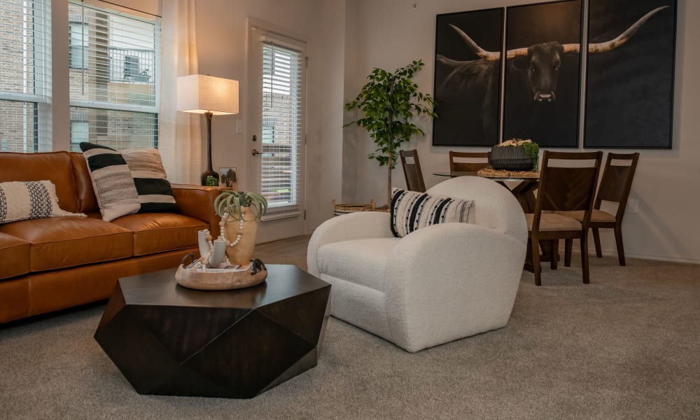 Bright and open living room and dining table at Redbud Ranch Apartments in Broken Arrow, Oklahoma