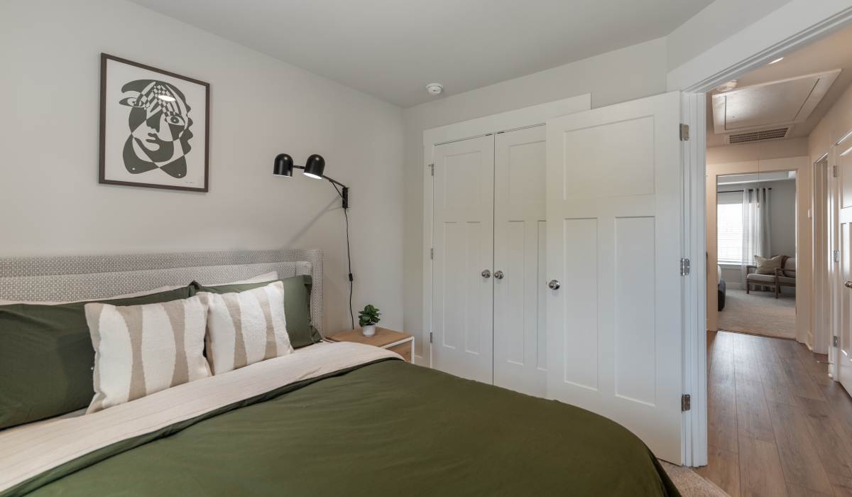 Bedroom with large comfortable bed and windows at Maybrook Terraces in Greenville, South Carolina