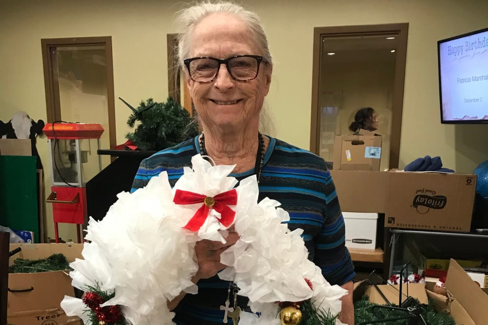 Resident with wreath at Edencrest at Siena Hills in Ankeny, Iowa