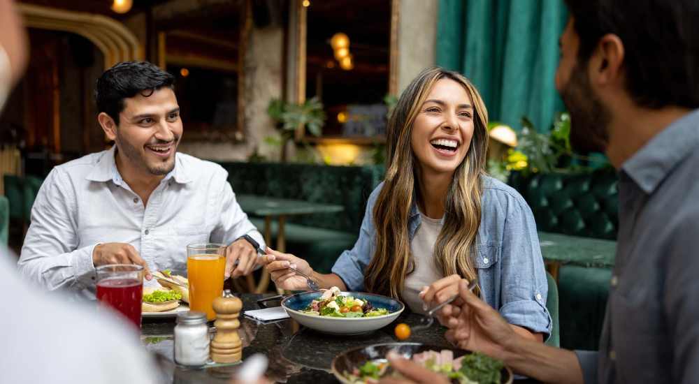 Friends enjoying meal in a nearby restaurant at DOCK 59 in Portland, Oregon