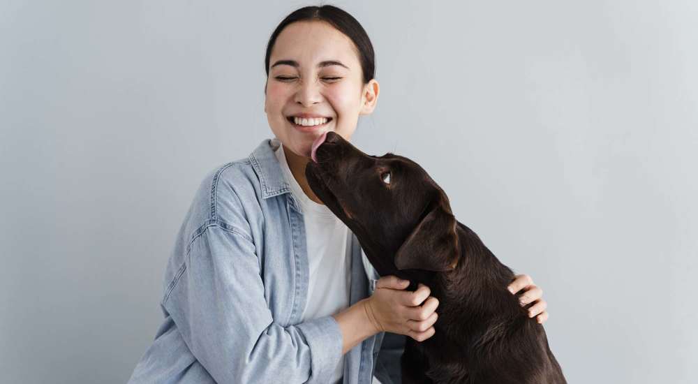 Resident with her pet at Hancock Terrace in Santa Maria, California