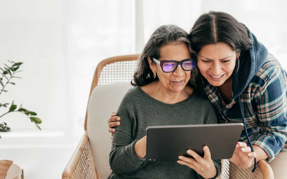 Senior resident with laptop at Huntington Place in Trumbull, Connecticut