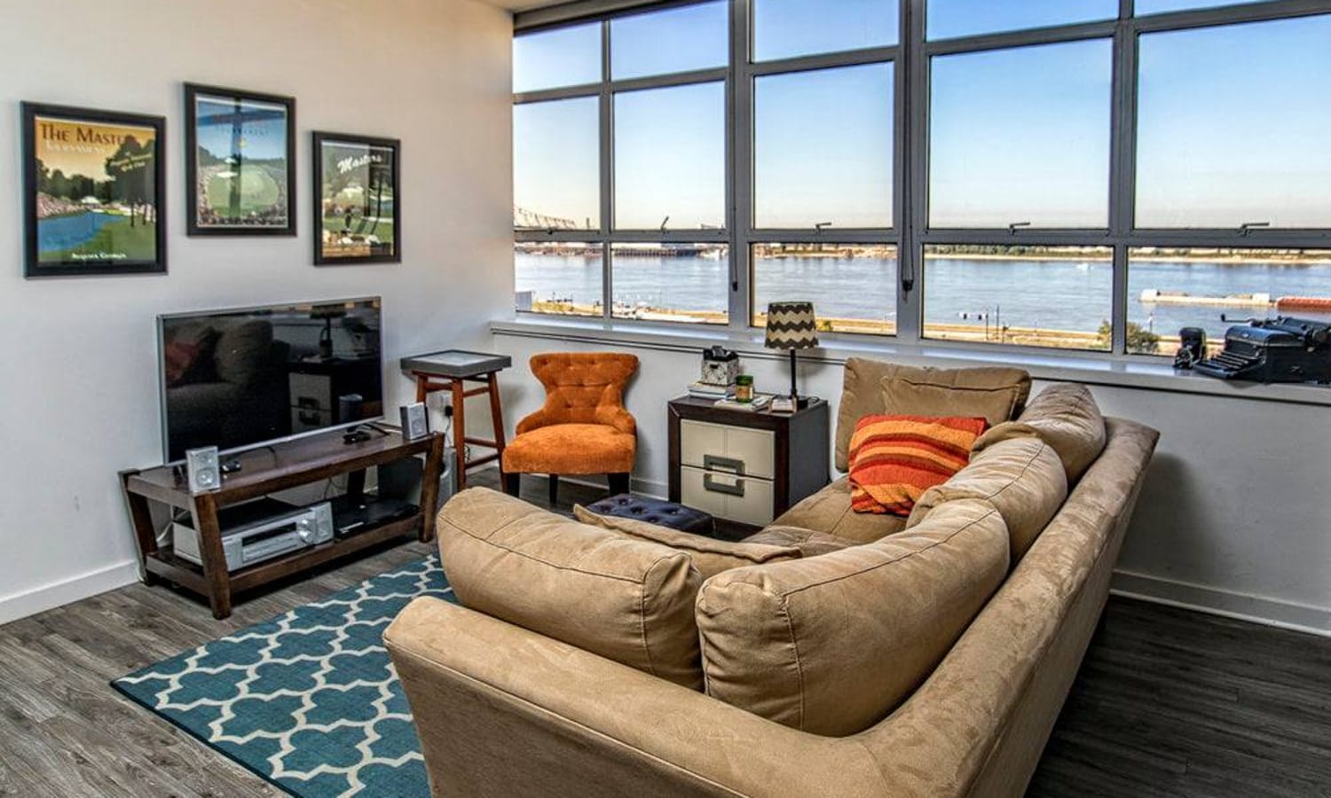 Apartment living room with a large window at 440 on Third Apartments in Baton Rouge, Louisiana