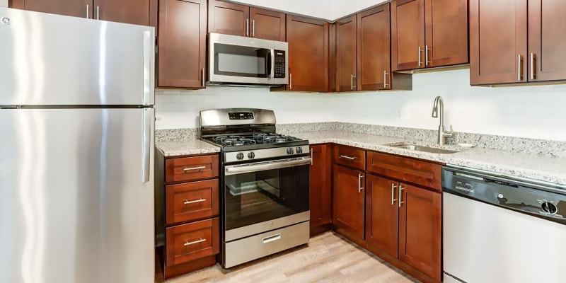 Model kitchen with granite countertops at Hampton Manor Apartments & Townhomes in Cockeysville, Maryland