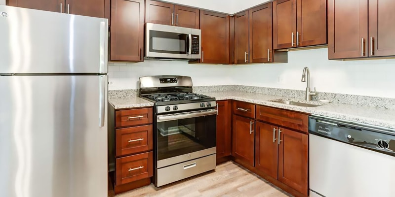 Model kitchen with granite countertops at Hampton Manor Apartments and Townhomes in Cockeysville, Maryland