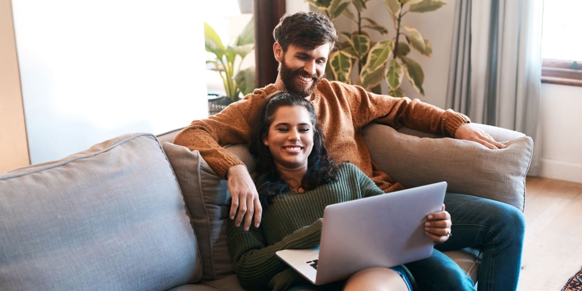 Couple working on their couch at Enclave at Grapevine in Grapevine, Texas