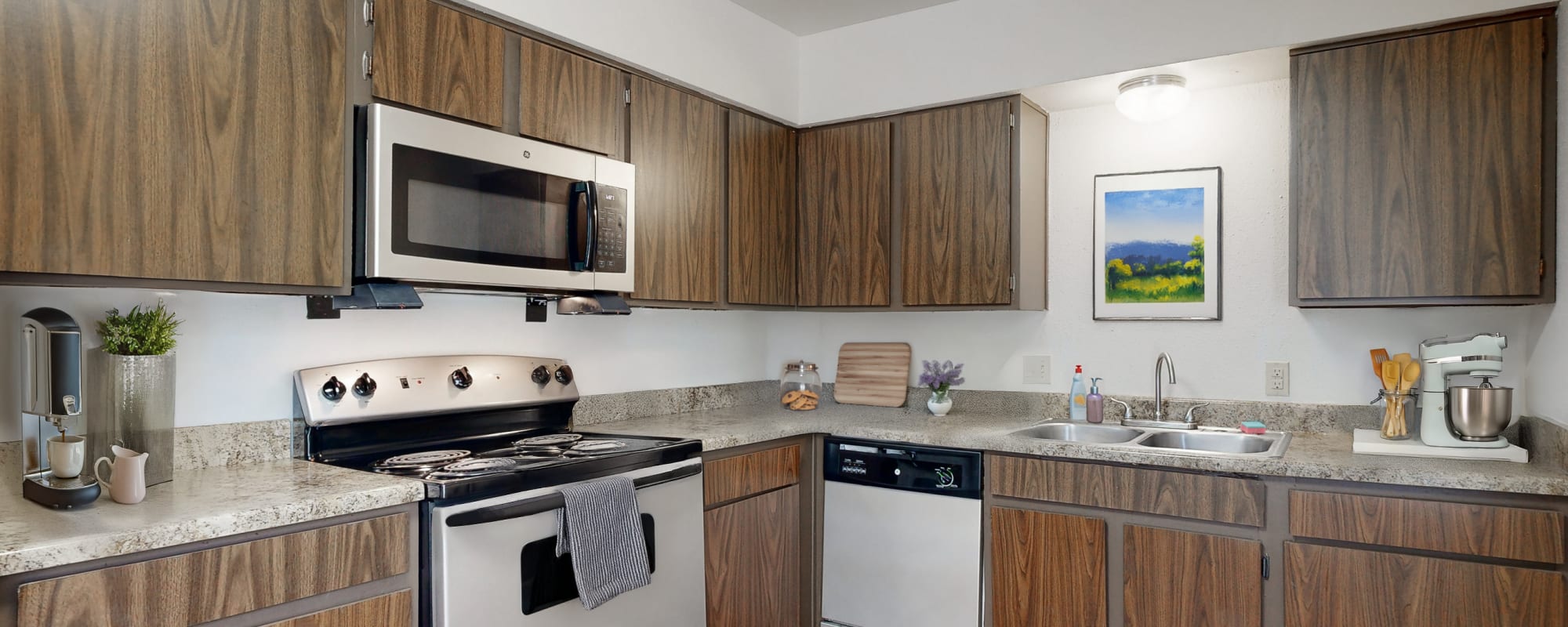 Well designed kitchen with stainless-steel appliances at Millbrook Apartments in Shreveport, Louisiana