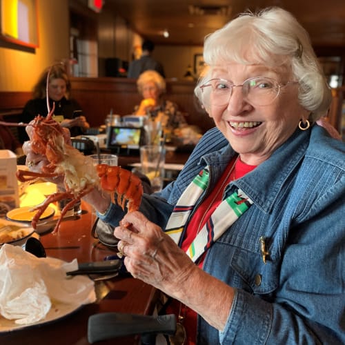 Resident eating lobster at a Presbyterian Communities of South Carolina community