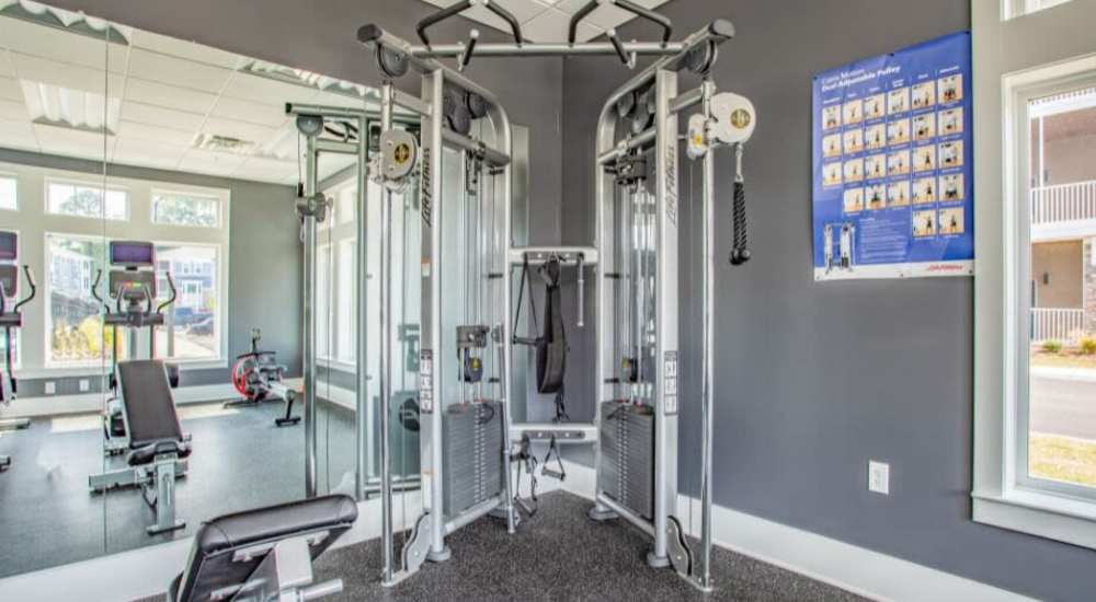 A well-quipped fitness center at The Apartments At Kelton Station in Williamsburg, Virginia