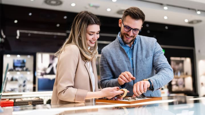 A man and a women shopping for a new watch