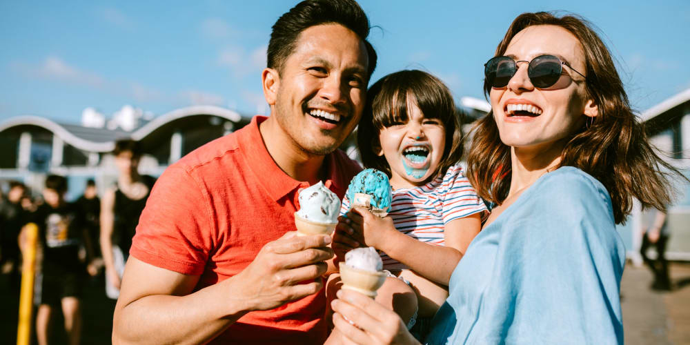 Family eating ice cream near Sanctuary Cove Apartments in West Palm Beach, Florida