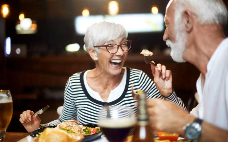 Happy couple having meal at Elan Manatee in Bradenton, Florida