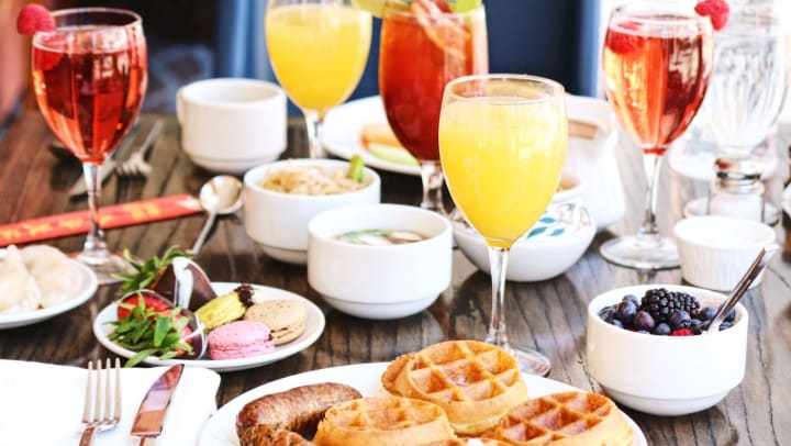 Waffles, sausage, and mimosa brunch