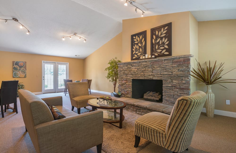 A rustic clubhouse with a large fireplace at Lakewood Apartment Homes in Salisbury, North Carolina