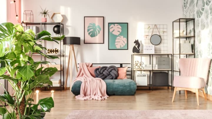 A beautifully designed living room interior with pink elements.