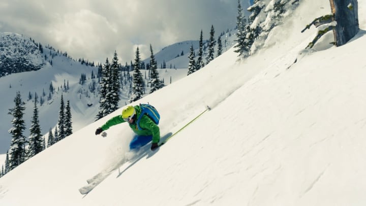 Advanced skier riding down some gnarly powder in Utah.