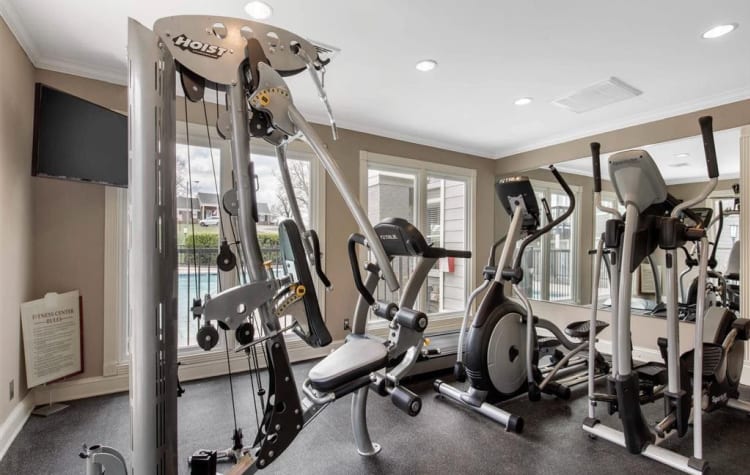 Fitness center for residents with individual workout stations at The Hamilton in Hendersonville, Tennessee