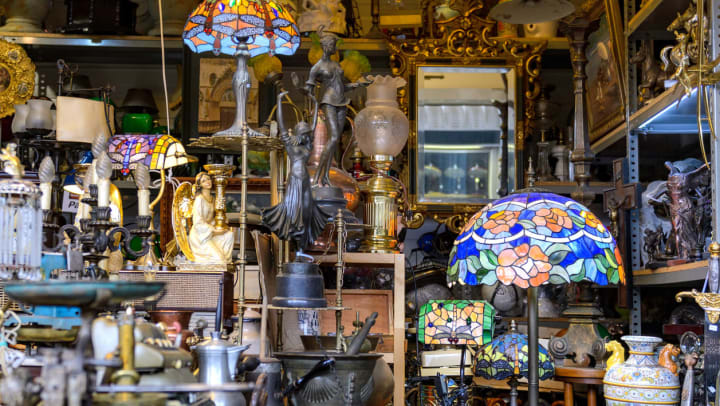 interior of an antique store with tons of furniture, old mirrors and stained glass lamps | antique stores near Chandler