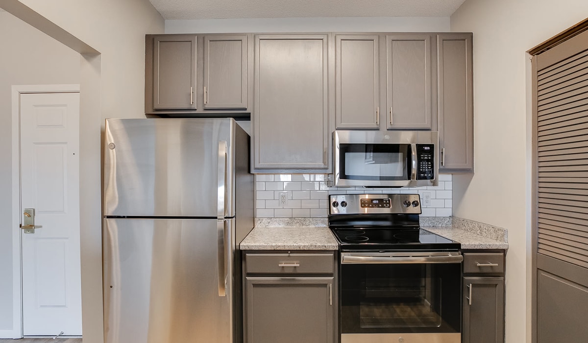 A spacious kitchen with stainless-steel appliances at Provence Apartments in Burnsville, Minnesota