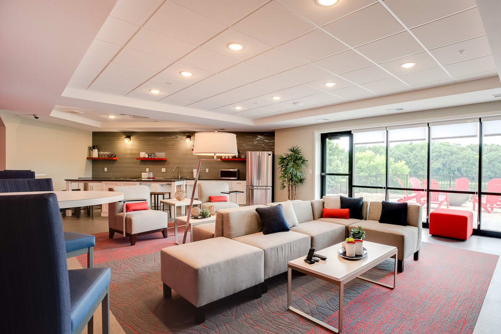 Expansive clubhouse with comfortable seating at Lake Jonathan Flats in Chaska, Minnesota