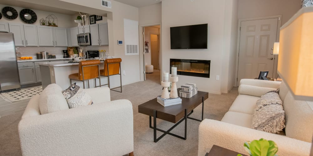 Stunning living room with plush carpet at 97@ North Oak in Kansas City, Missouri