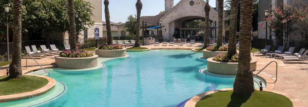 A resort-style swimming pool at Sommerall Station Apartments in Houston, Texas