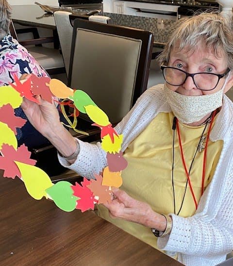 Arbour Square residents showed off their colorful leaf wreaths. 