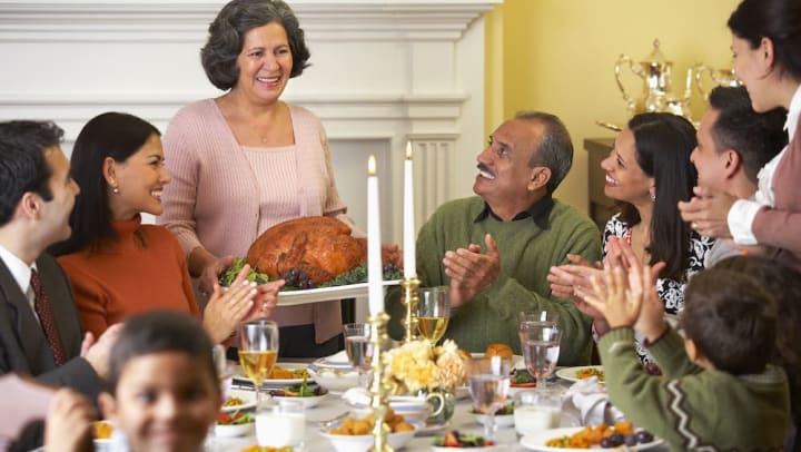 Family at thanksgiving dinner table