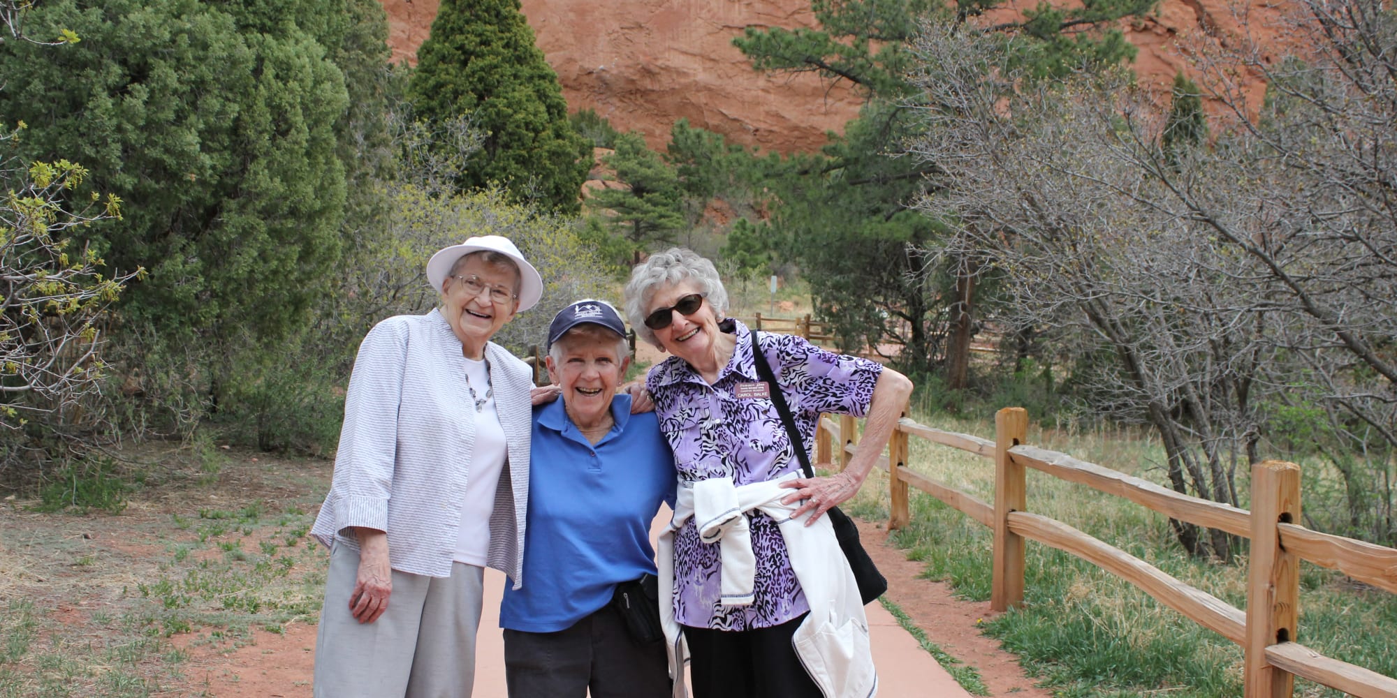 Three residents from Summit Glen in Colorado Springs, Colorado going for a hike