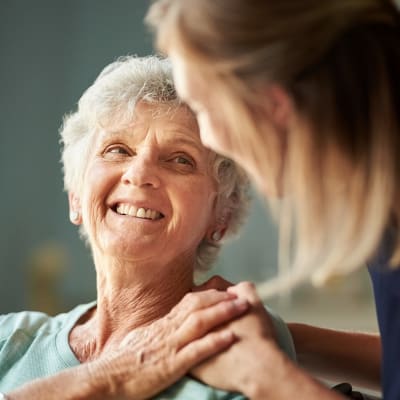 Resident smiling at caretaker at Seven Lakes Memory Care in Loveland, Colorado