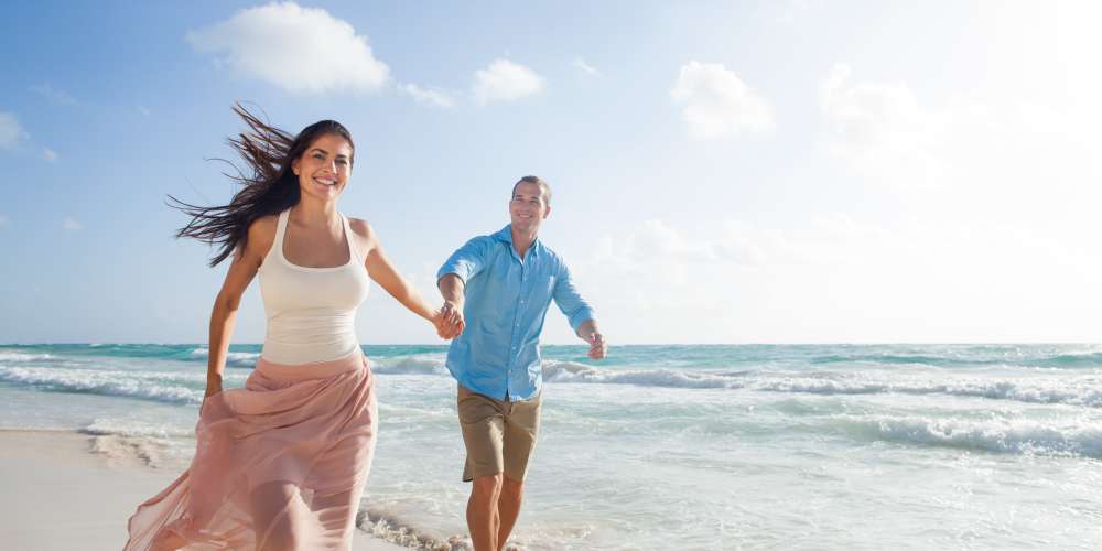 Residents walking on the beach near Las Marinas in Sunny Isles Beach, Florida
