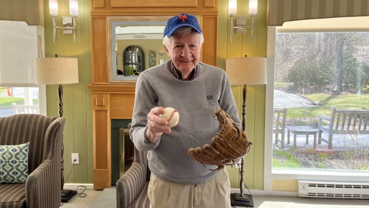 Resident holding baseball