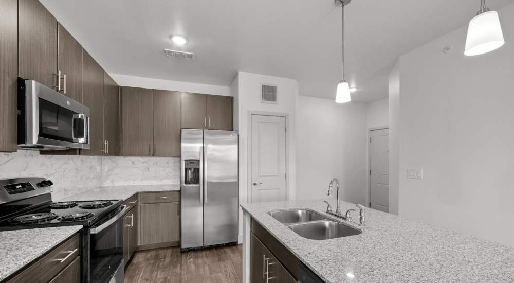 Fully equipped kitchen with stainless steel appliances at Brook Hollow in Wichita Falls, Texas