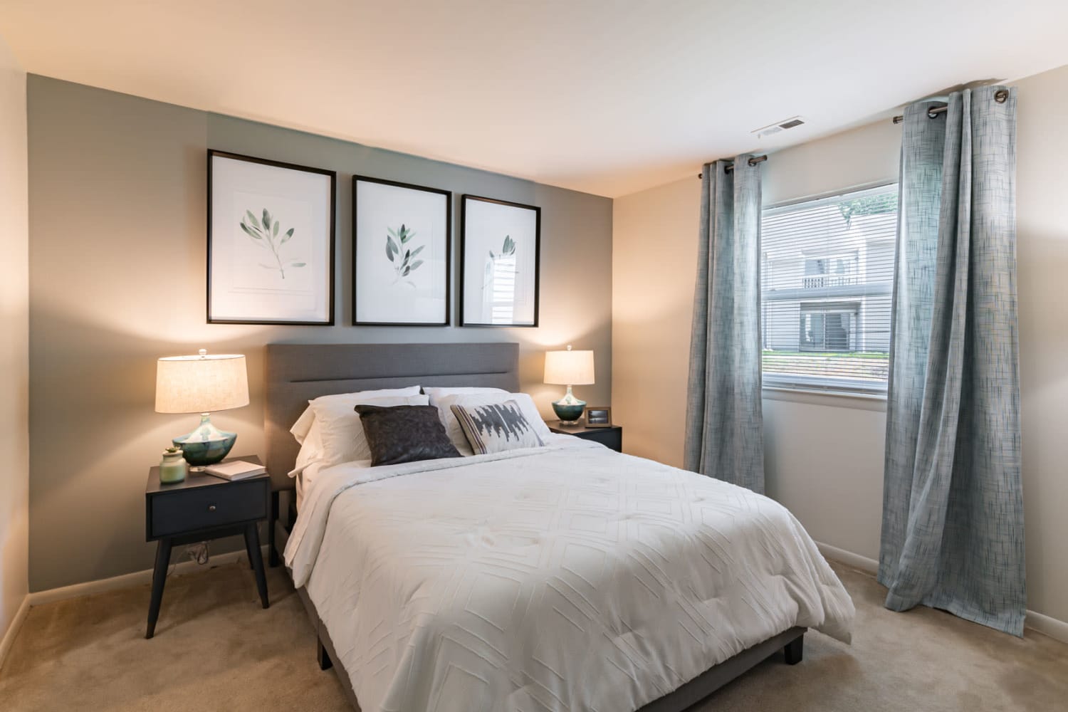 Model bedroom with plush carpeting at The Landings Apartment Homes in Absecon, New Jersey