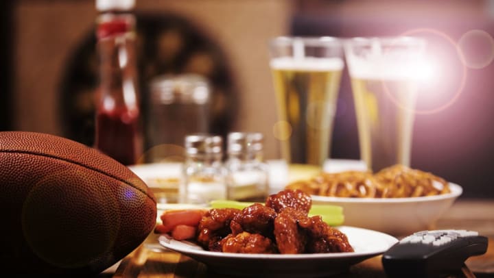 a football, buffalo wings, and beer at a Katy bar