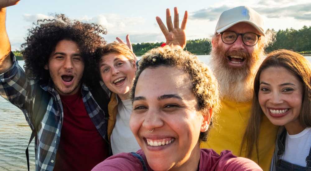 Residents taking selfie near The Caroline in New York, New York