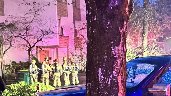 firefighters at apartment building