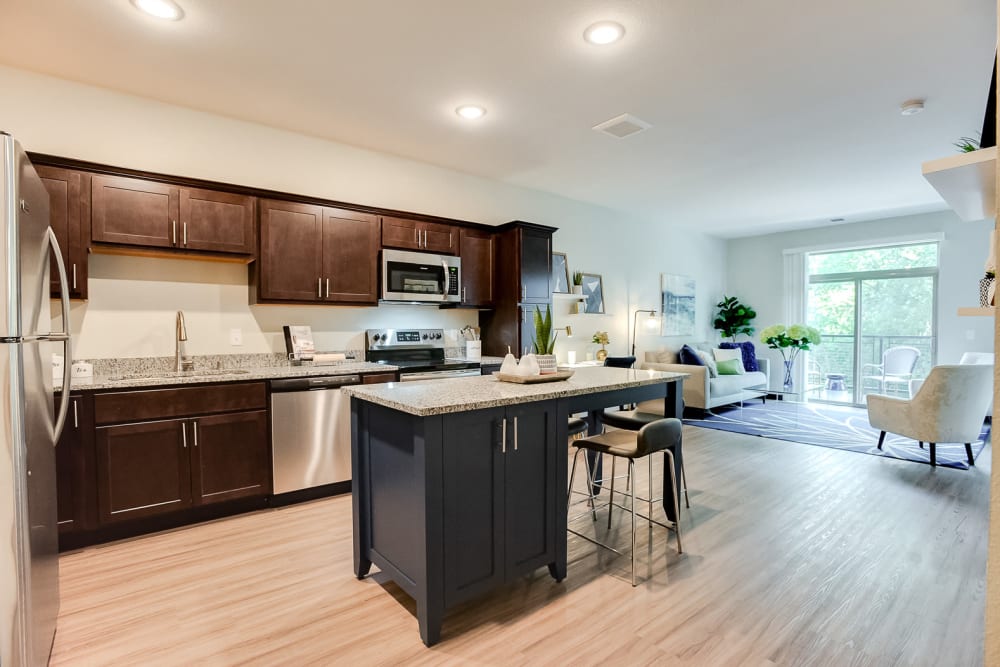 Open kitchen with plenty of cabinet space at Manassas Station Apartments in Manassas, Virginia