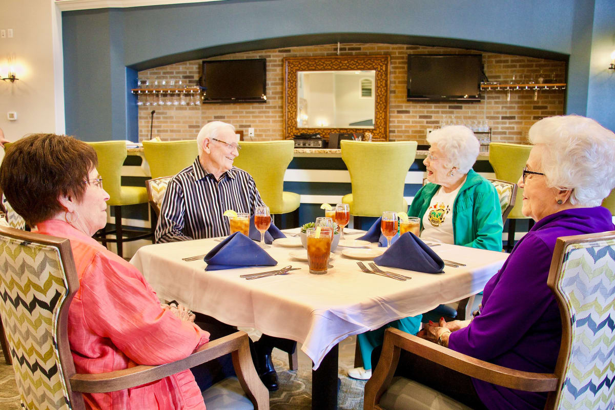Residents sitting down for a meal at Raider Ranch in Lubbock, Texas