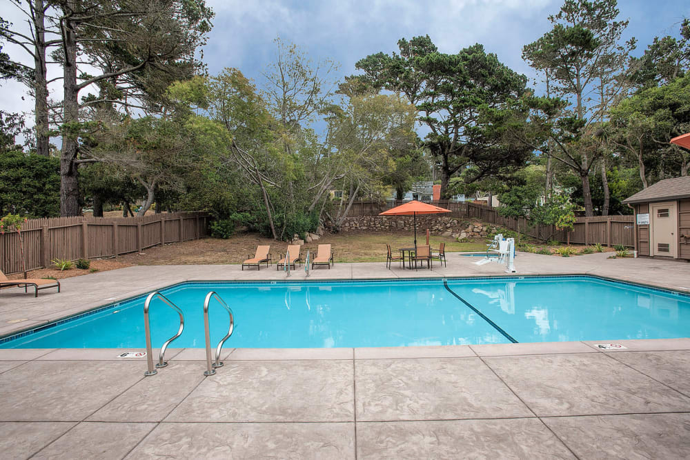 Resort-style swimming pool at Seventeen Mile Drive Village Apartment Homes in Pacific Grove, California