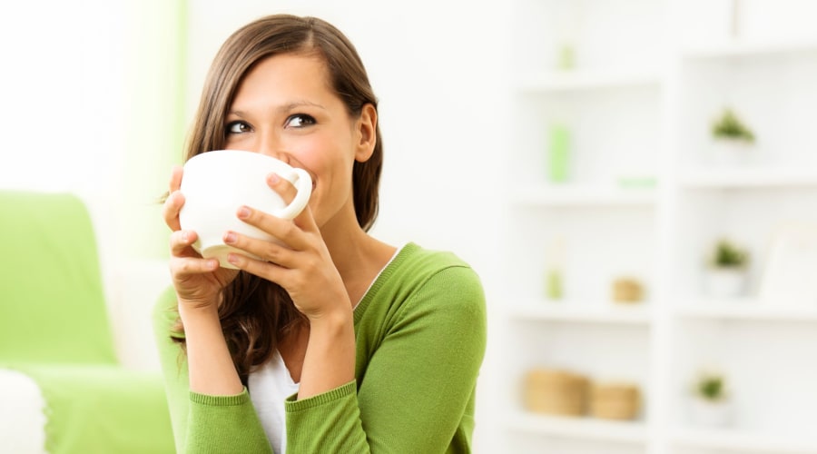 Resident drinking coffee in Franklin, TN near Magnolia Place Apartments