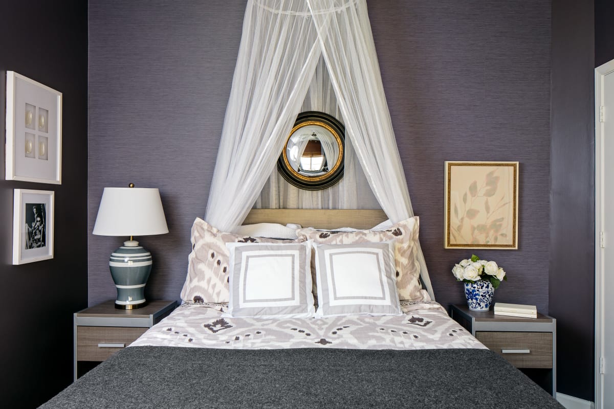 Elegant model bedroom with a canopy at The Vic in Greensboro, North Carolina