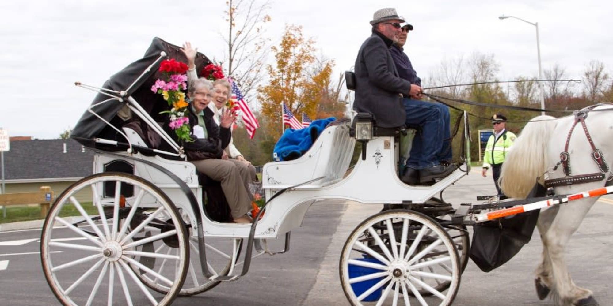 Two happy residents from Cottonwood Estates Gracious Retirement Living in Alpharetta, Georgia in a horse-drawn carriage