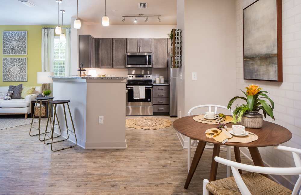 An open kitchen with coffee table and chairs at Pier Park Crossings in Panama City Beach, Florida