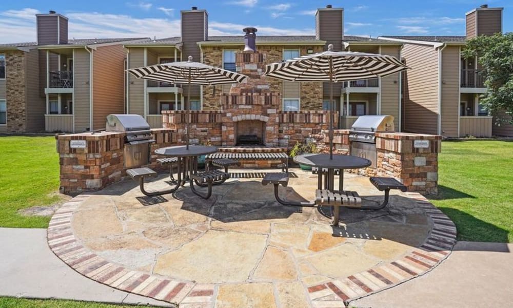 the Outdoor fireplace and benches at Cimarron Trails Apartments in Norman, Oklahoma