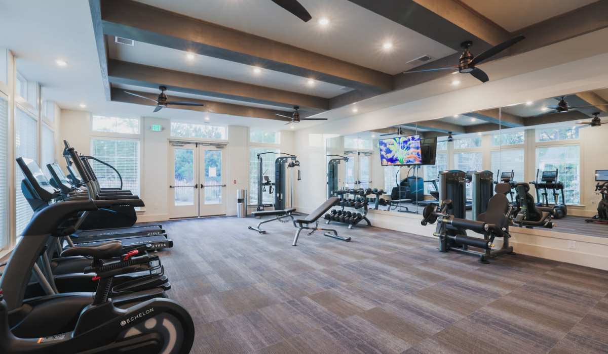 Well-equipped fitness center at Riverwood Apartments in Wilmington, North Carolina
