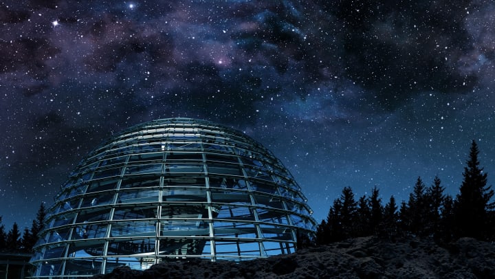 planetarium building exterior night view and starry skies above | Cox Science Center
