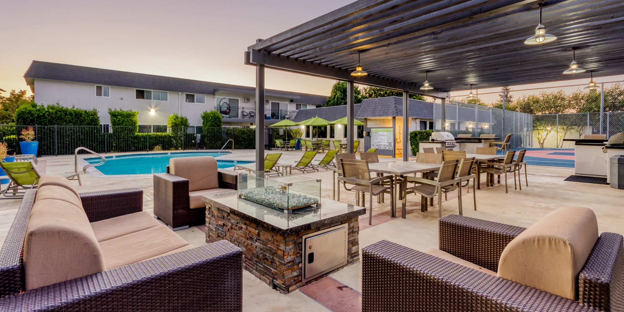 Luxurious swimming pool and outdoor lounging at The Arbors at Magnolia in Anaheim, California